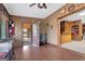 The open living area features hardwood floors, wood paneling, and access to a screened porch at 562 Adams Rd, Fayetteville, GA 30214