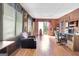 Spacious living area with wood paneling, tile ceiling, natural light, and comfortable seating at 562 Adams Rd, Fayetteville, GA 30214