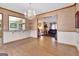 Bright living space featuring hardwood floors, modern lighting, and views into the kitchen and living room at 562 Adams Rd, Fayetteville, GA 30214