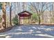 Covered shed next to mature trees at 562 Adams Rd, Fayetteville, GA 30214