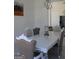 Formal dining room with a decorative table setting, elegant seating, and modern lighting at 337 Lakeshore Dr, Berkeley Lake, GA 30096