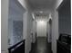 Hallway with dark wood floors and white walls showing natural light and architectural elements at 337 Lakeshore Dr, Berkeley Lake, GA 30096