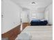 Modest bedroom with wood floors, twin beds, and natural lighting at 1444 Norman Berry Dr, East Point, GA 30344
