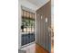 View through the open front door showcasing a security gate and a glimpse of the welcoming exterior at 1444 Norman Berry Dr, East Point, GA 30344