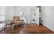 Cozy living room featuring hardwood floors, a decorative chair and ample natural light at 1444 Norman Berry Dr, East Point, GA 30344