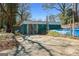 View of shed and concrete parking area behind the house at 1444 Norman Berry Dr, East Point, GA 30344