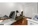 Bedroom featuring a work space, an exercise bike, hardwood floors, and closet space at 555 Windchase Ln, Stone Mountain, GA 30083