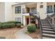 Charming condo building featuring tidy landscaping and eye-catching red doors at 555 Windchase Ln, Stone Mountain, GA 30083