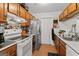 Efficient kitchen layout featuring tile floors and lots of cabinet space at 555 Windchase Ln, Stone Mountain, GA 30083