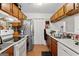 Efficient kitchen layout featuring tile floors and lots of cabinet space at 555 Windchase Ln, Stone Mountain, GA 30083