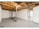 An unfinished basement with concrete walls and floors, and an exposed ceiling at 256 Butterworth Rd, Canton, GA 30114