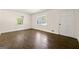 Bedroom features hardwood floors, natural light, and neutral paint at 256 Butterworth Rd, Canton, GA 30114