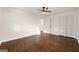 A bright bedroom features wood flooring, a ceiling fan, and a double-door closet at 256 Butterworth Rd, Canton, GA 30114