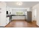 Spacious eat-in kitchen featuring white cabinets, stainless steel appliances, and ample counter space at 256 Butterworth Rd, Canton, GA 30114