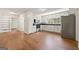 Bright kitchen featuring white cabinets, black countertops, stainless steel appliances, and wood-look floors at 256 Butterworth Rd, Canton, GA 30114
