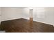 Hardwood floors, neutral paint and natural light fill this open living area at 256 Butterworth Rd, Canton, GA 30114