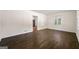 Bright living room featuring hardwood floors and natural light from the window at 256 Butterworth Rd, Canton, GA 30114