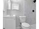 Updated bathroom with new toilet, vanity, mirror, and tiled shower at 3047 Horse Shoe Se Dr, Atlanta, GA 30316