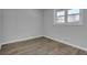 Cozy bedroom features a window letting in natural light and beautiful floors at 3047 Horse Shoe Se Dr, Atlanta, GA 30316
