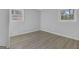 This well lit bedroom features two windows and new hardwood floors at 3047 Horse Shoe Se Dr, Atlanta, GA 30316