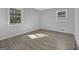Bedroom features neutral walls, hardwood floors and two sunlit windows at 3047 Horse Shoe Se Dr, Atlanta, GA 30316