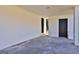 Spacious carport featuring a concrete floor and neutral painted brick walls and doors at 3047 Horse Shoe Se Dr, Atlanta, GA 30316