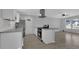 Modern kitchen featuring stainless steel appliances, granite countertops, and white cabinetry at 3047 Horse Shoe Se Dr, Atlanta, GA 30316