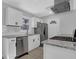 Modern kitchen with white cabinetry, stainless steel appliances, and granite countertops at 3047 Horse Shoe Se Dr, Atlanta, GA 30316