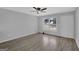 Bright and airy living room with hardwood floors, neutral paint, and a large window at 3047 Horse Shoe Se Dr, Atlanta, GA 30316