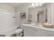 Bathroom with a tub-shower combination, white vanity, framed art, and a decorative basket at 44 Leggit Dr # 179, Villa Rica, GA 30180