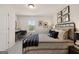 Bedroom with iron bed frame, decorative pillows, desk, and minimalist wall art at 44 Leggit Dr # 179, Villa Rica, GA 30180