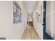 Inviting foyer with wood floors, modern artwork and transom window at the door at 44 Leggit Dr # 179, Villa Rica, GA 30180