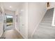 Bright entryway with open staircase and wood-look flooring at 44 Leggit Dr # 179, Villa Rica, GA 30180