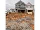 New construction townhomes feature an attached garage and modern architectural design at 44 Leggit Dr # 179, Villa Rica, GA 30180
