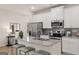 Stylish kitchen with granite counters, stainless appliances and gray accent tile at 44 Leggit Dr # 179, Villa Rica, GA 30180