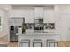 Modern kitchen with white cabinetry, subway tile backsplash, and a granite island at 44 Leggit Dr # 179, Villa Rica, GA 30180