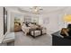 Bright main bedroom features a tray ceiling, ceiling fan, sitting area, and natural light at 44 Leggit Dr # 179, Villa Rica, GA 30180