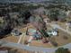 Aerial view of a residential property showcasing a swimming pool, spacious yard, and surrounding lush greenery at 140 Surrey Park Dr, Fayetteville, GA 30215