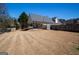 Sprawling fenced backyard featuring a covered patio, offering privacy and space for outdoor enjoyment at 140 Surrey Park Dr, Fayetteville, GA 30215