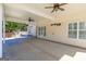 Open backyard patio with view of a well manicured lawn and beautiful trees at 140 Surrey Park Dr, Fayetteville, GA 30215