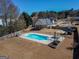 Inviting backyard pool area featuring lounge chairs, a diving board, and a fenced perimeter for privacy at 140 Surrey Park Dr, Fayetteville, GA 30215