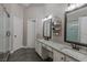 Modern bathroom with granite counters, and vanities, and stand alone shower at 140 Surrey Park Dr, Fayetteville, GA 30215
