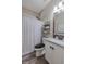 Bathroom featuring modern vanity with granite countertops and tiled floors at 140 Surrey Park Dr, Fayetteville, GA 30215