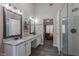 Spacious bathroom with double vanity, granite countertops, and tile flooring at 140 Surrey Park Dr, Fayetteville, GA 30215