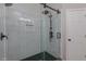 Modern bathroom shower featuring rain head and hexagon tile floor at 140 Surrey Park Dr, Fayetteville, GA 30215
