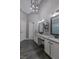 Bathroom featuring and vanities, granite counters, decorative lighting, and modern shower at 140 Surrey Park Dr, Fayetteville, GA 30215