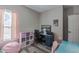 Well lit bedroom with light pink curtains and a view of the front yard at 140 Surrey Park Dr, Fayetteville, GA 30215
