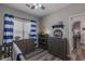 Nicely decorated bedroom with gray furniture and blue accents at 140 Surrey Park Dr, Fayetteville, GA 30215