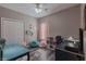 Bright bedroom featuring hardwood floors, storage cubes, and a desk at 140 Surrey Park Dr, Fayetteville, GA 30215