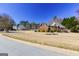 Well-maintained brick home with lush landscaping, set in a suburban neighborhood with mature trees at 140 Surrey Park Dr, Fayetteville, GA 30215